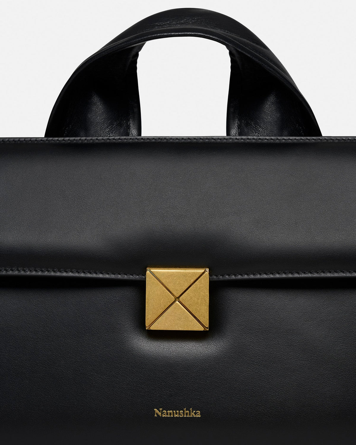 The SANDI Lock Top handle bag - Black | Nanushka