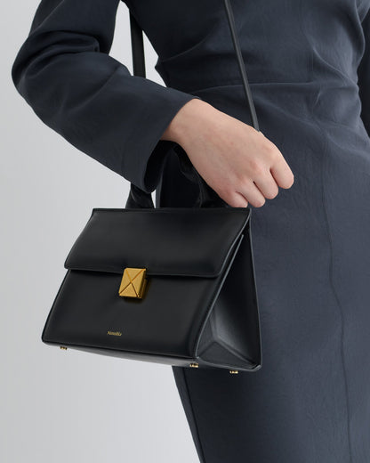 The SANDI Lock Top handle bag - Black | Nanushka