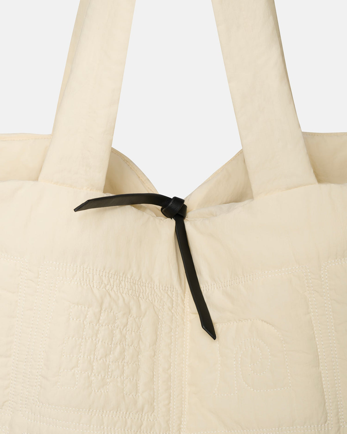 Symbol Quilted tote bag - Creme | Nanushka
